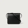 Geantă de umăr, Mini, Double C De Cartier – Piele de vițel neagră, finisaj auriu și email negru – Cartier